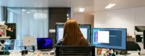 Woman working in an office performing penetration testing